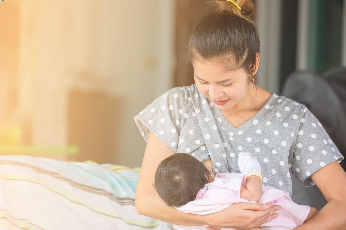 Asian mother breastfeeding her baby 
