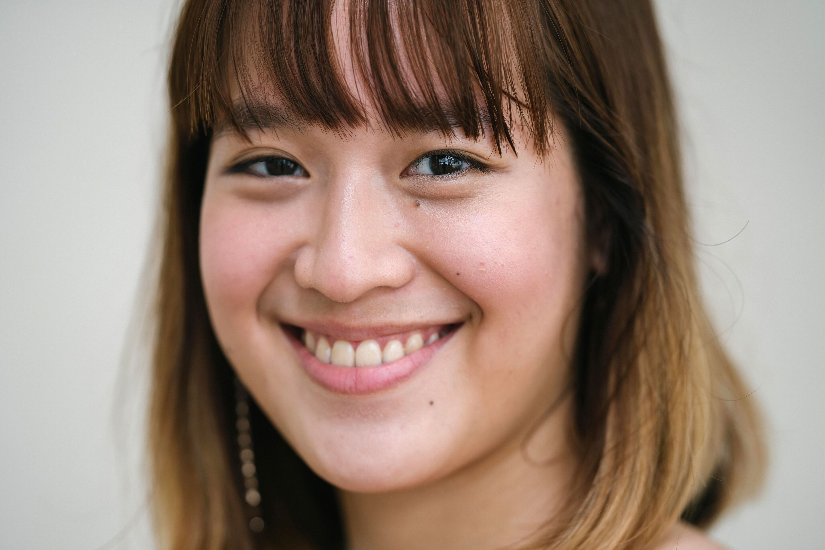 a woman with short hair and bangs