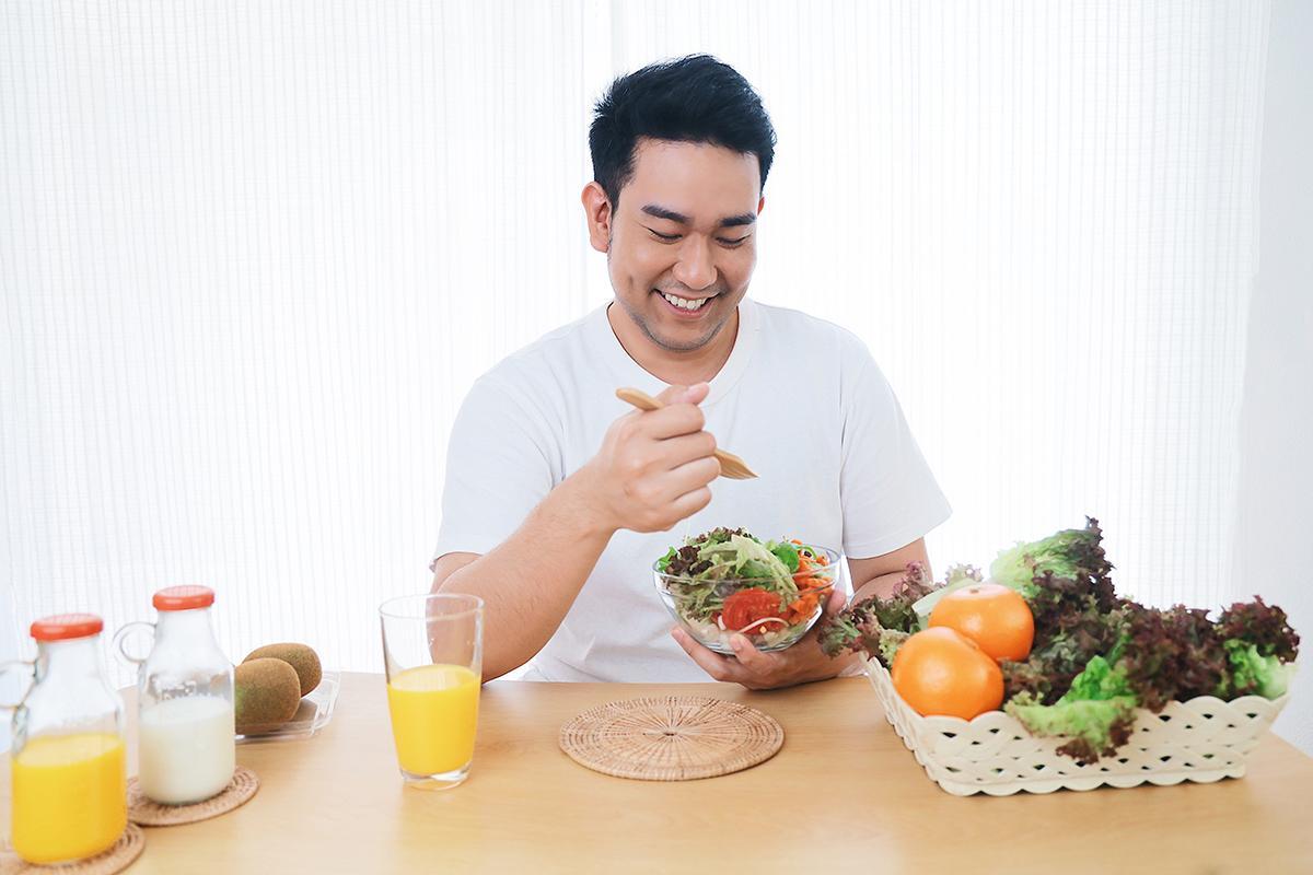 Asian man eating healthy food
