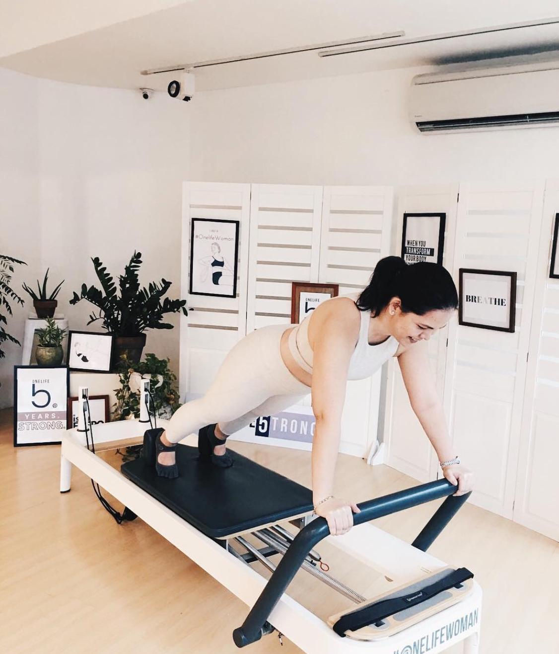 Woman on Pilates reformer