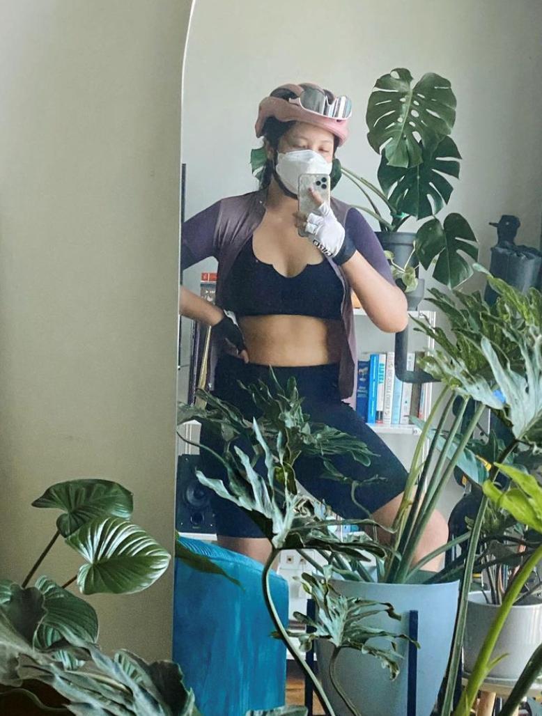 Woman taking a mirror selfie in biking attire