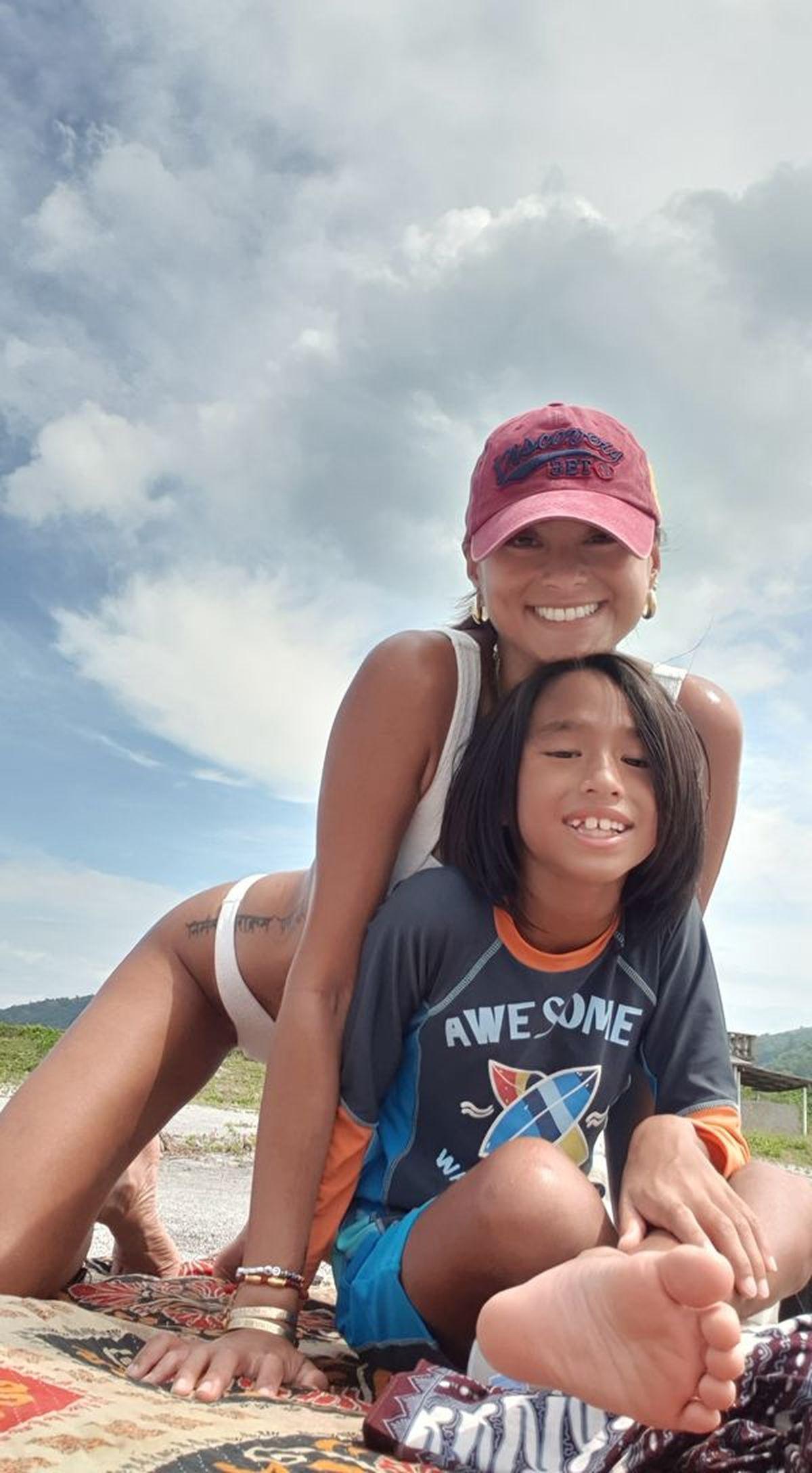 Asian woman and son outdoors