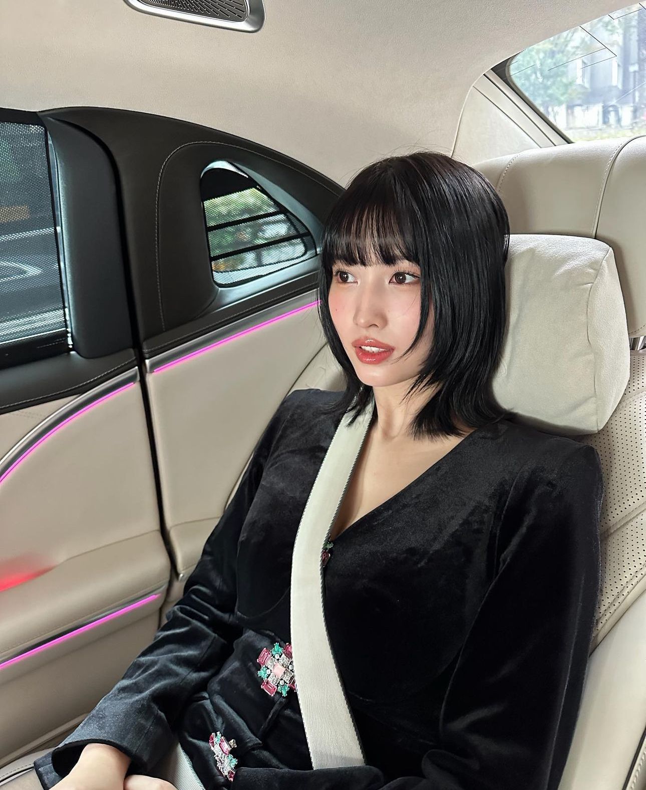 Woman with black jellyfish haircut.