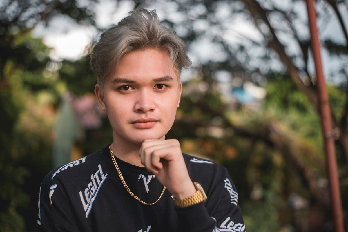 Asian man with light hair