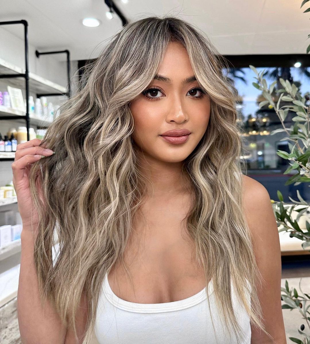 Woman with long blonde highlights.