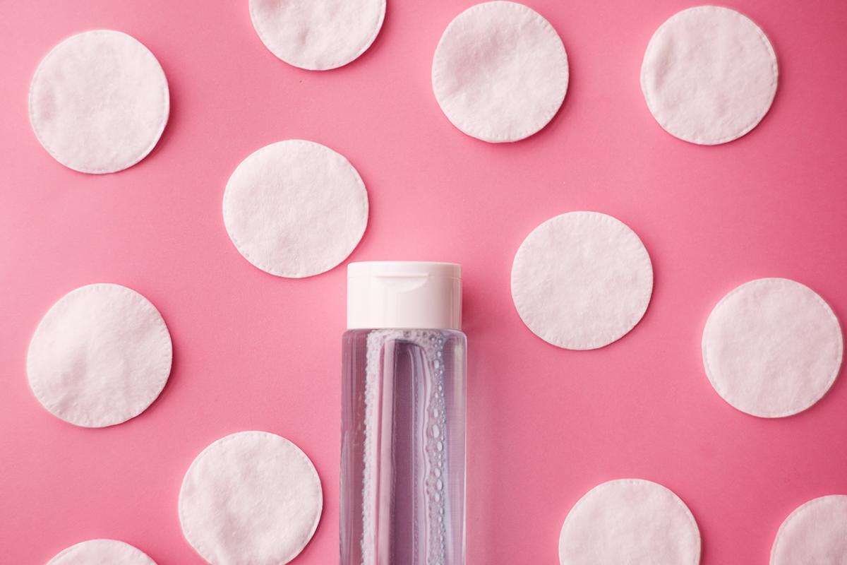 Cotton pads and a bottle of toner