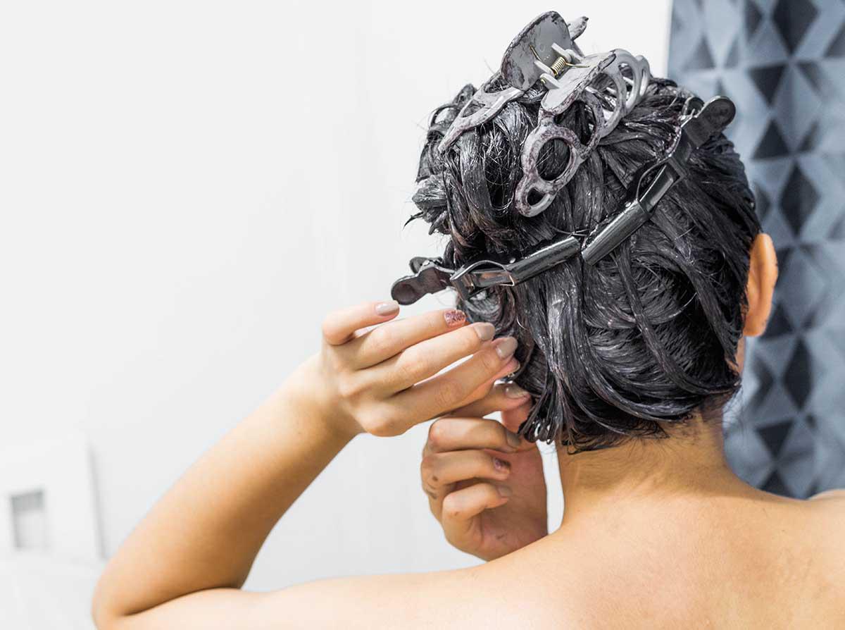 Woman coloring her hair by herself