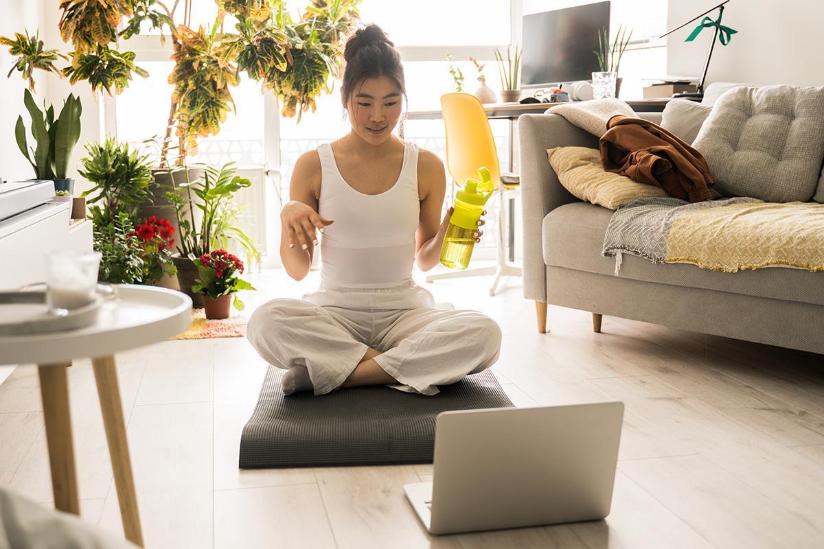 Girl practicing virtual yoga