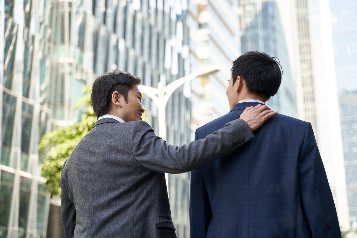 Asian men walking together