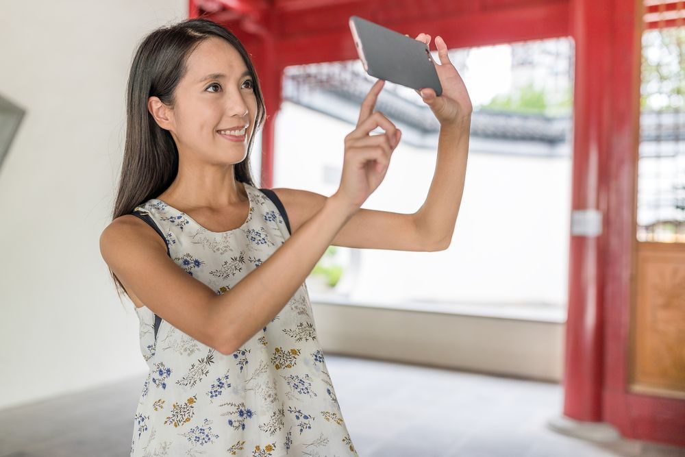 An Asian woman taking a selfie