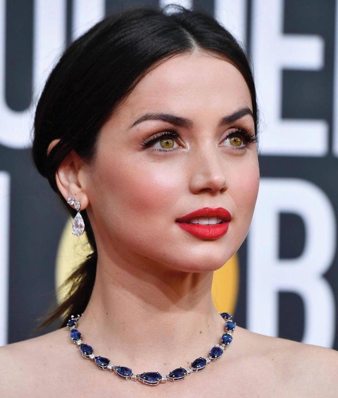 Ana de Armas wearing red lipstick on the red carpet