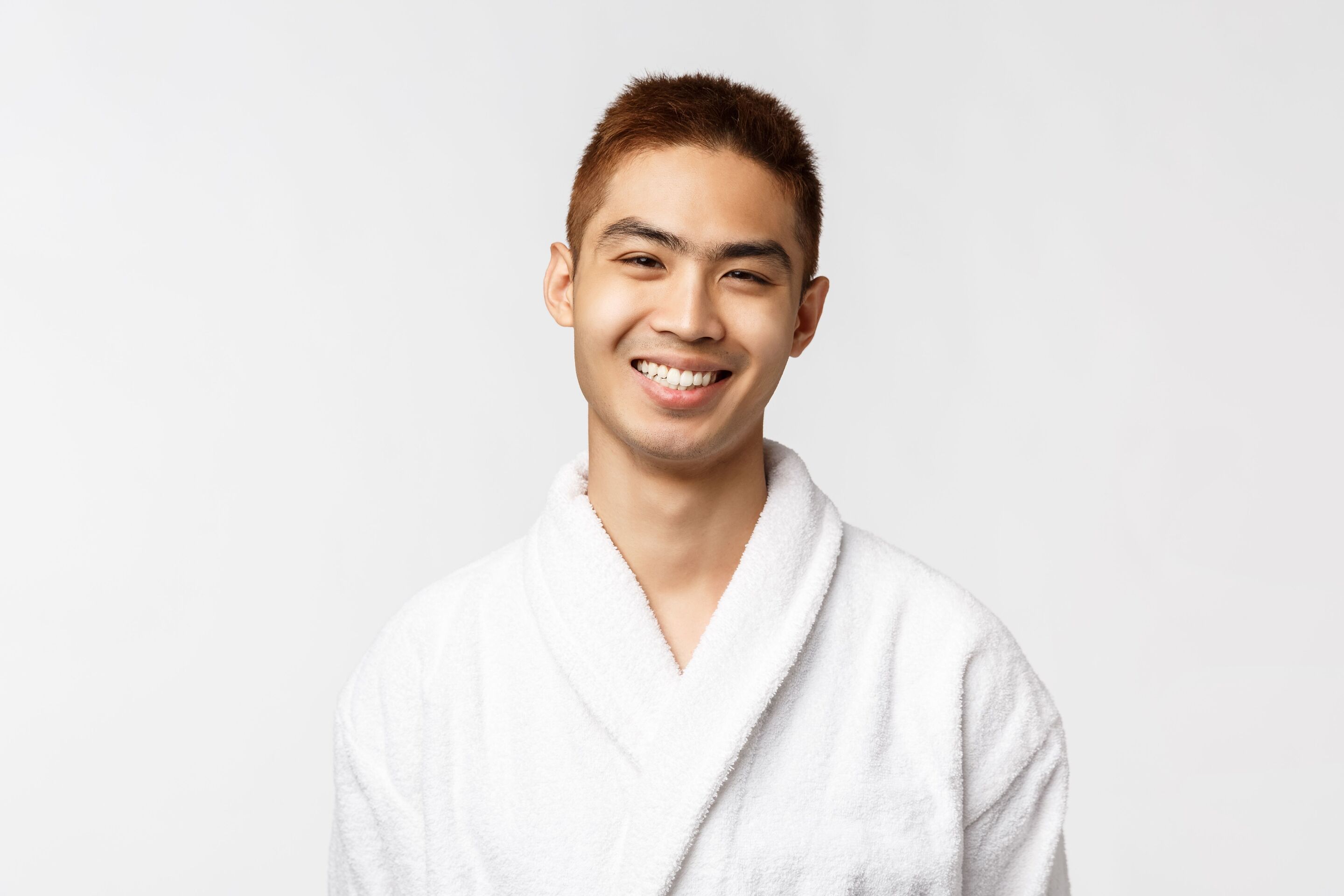 Asian man wearing bathrobe