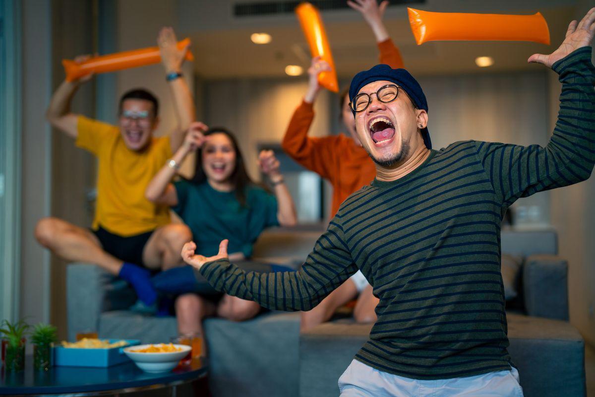 Asian friends enjoying game 