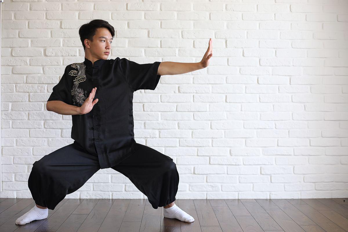 Asian man practicing wushu 