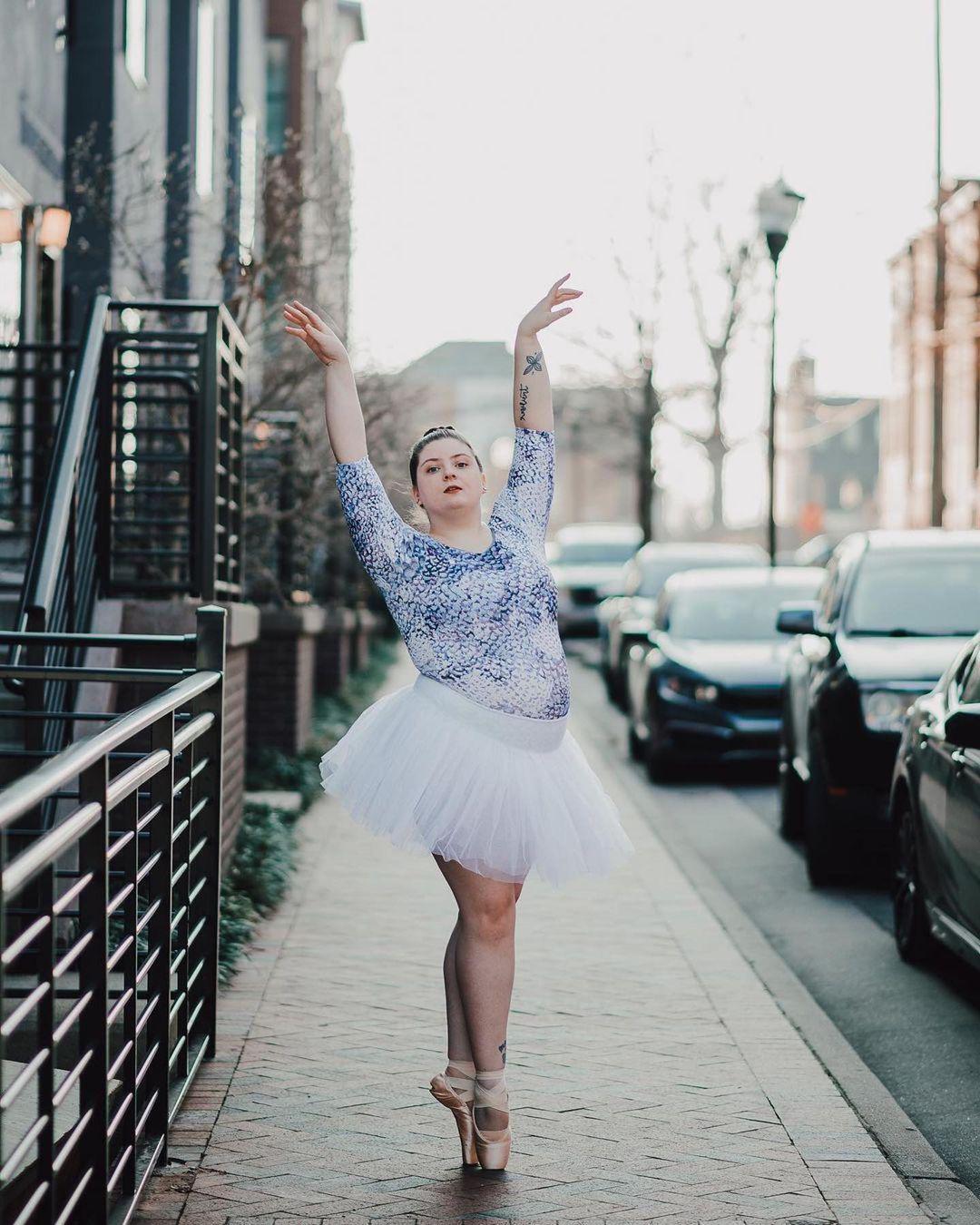 A plus size Caucasian woman posing majestically in her ballet attire 