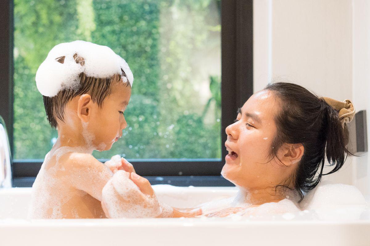 Mom and son in a bath 