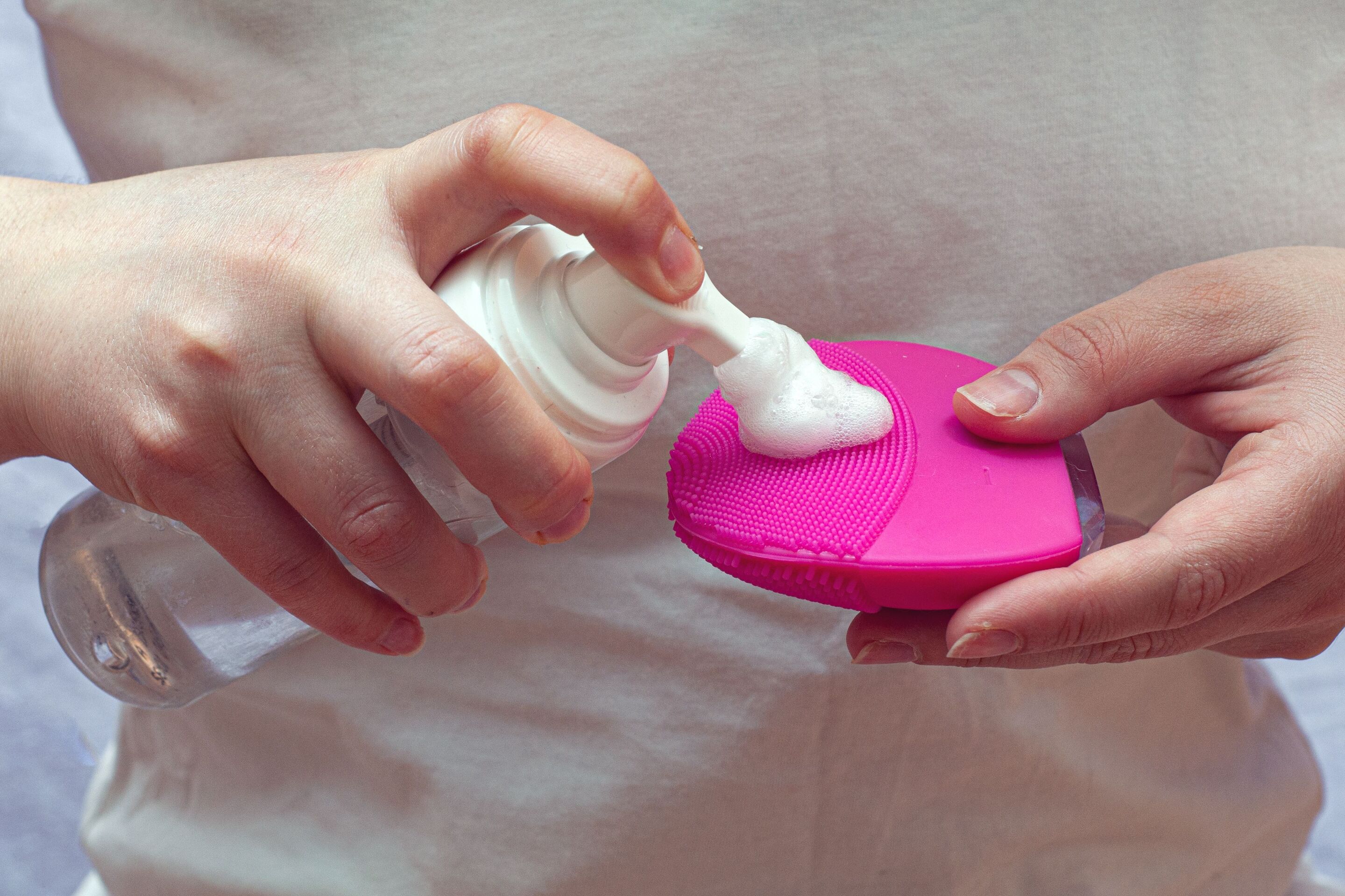 Woman holding silicone cleaning brush 