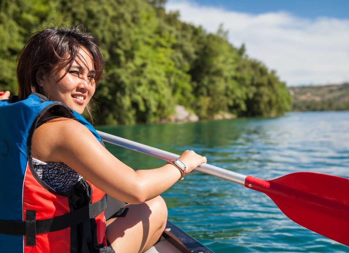 Asian woman on kayak