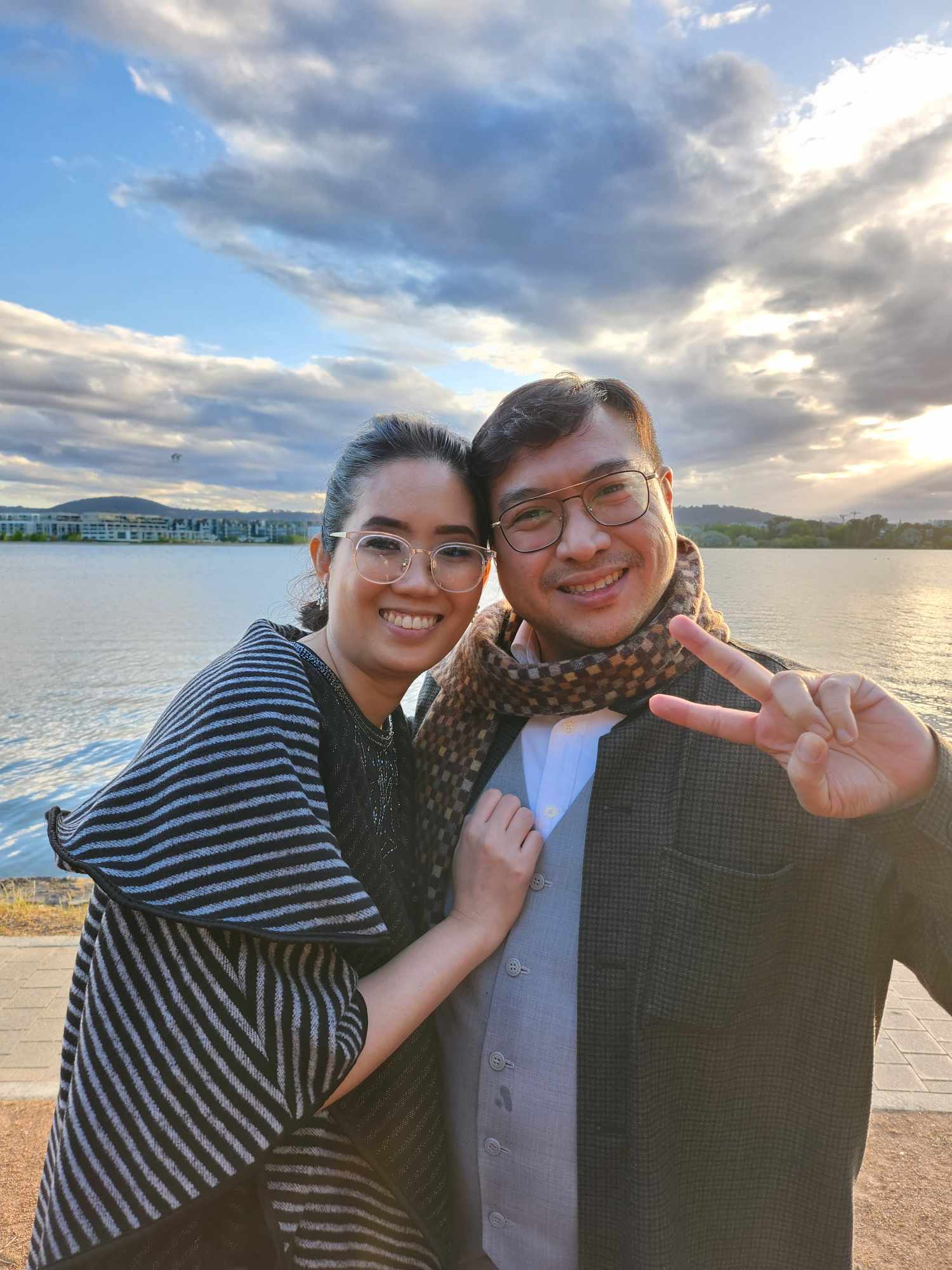 A portrait of happy couple posing at the beach.