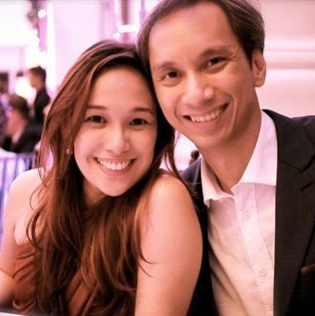 A portrait of smiling couple at a restaurant.