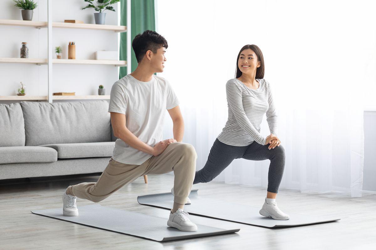 Asian couple stretching
