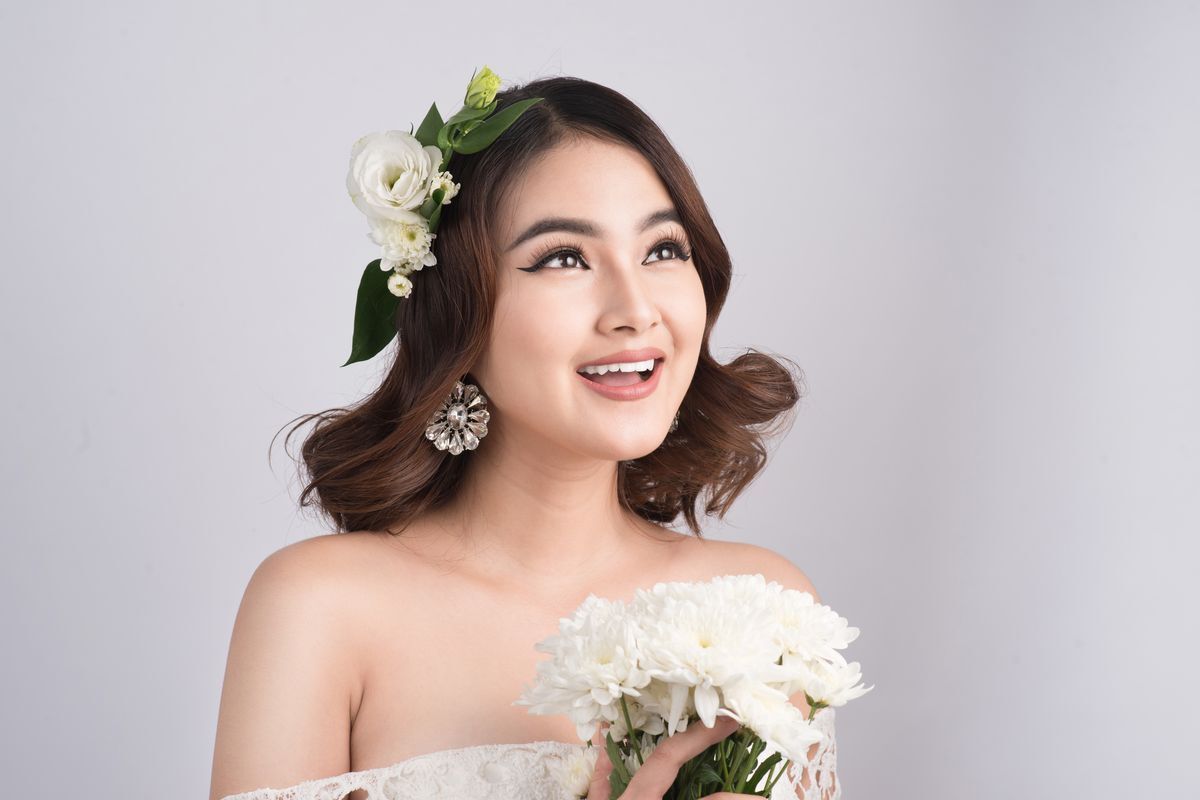 Asian bride with flowers in hair 