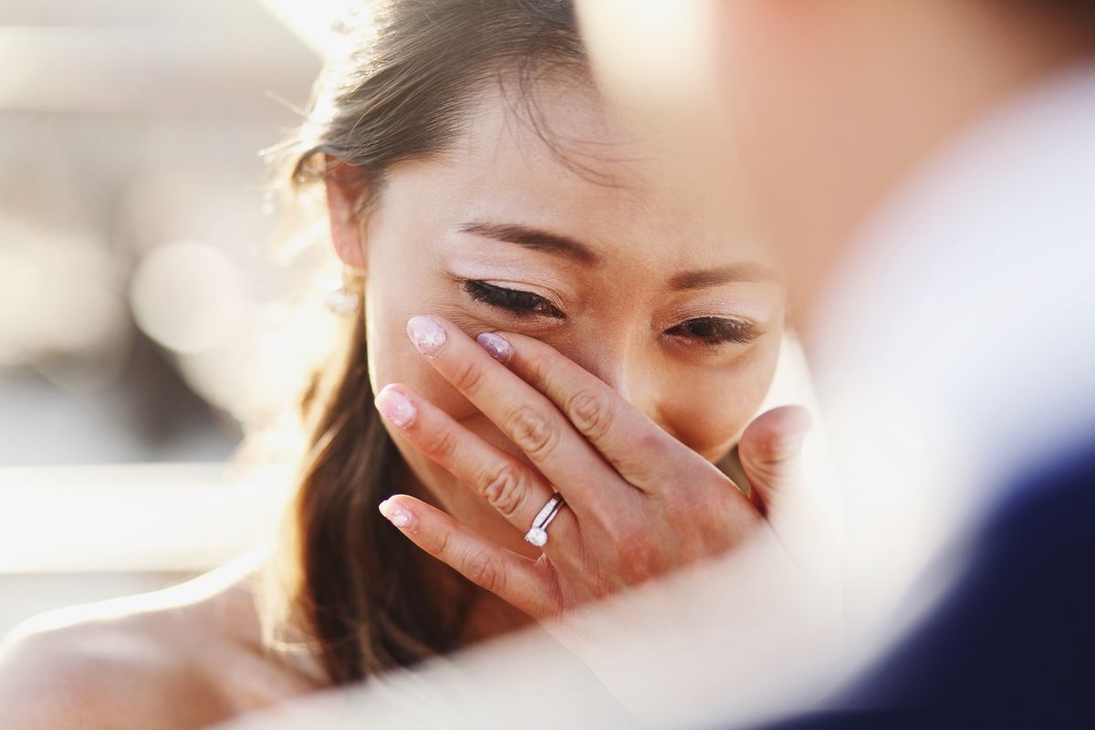 Asian bride holding back tears 