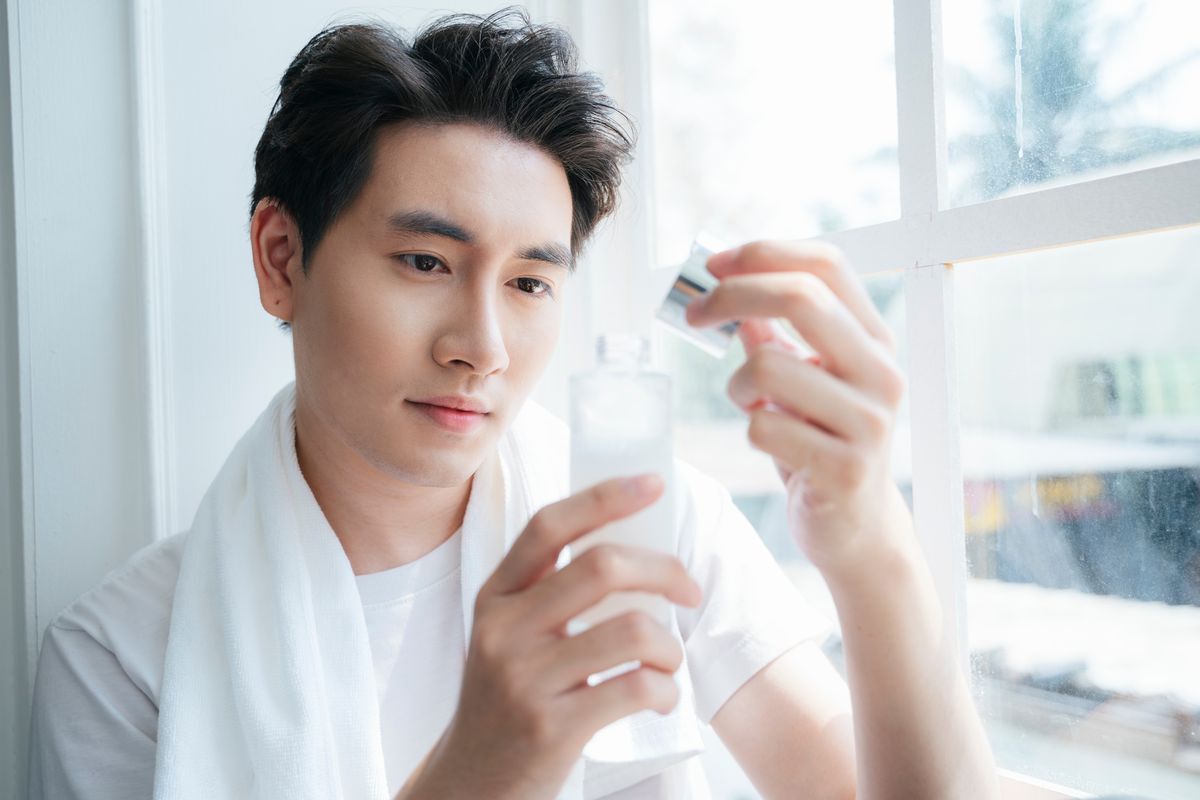 Man about to start his skincare routine.  