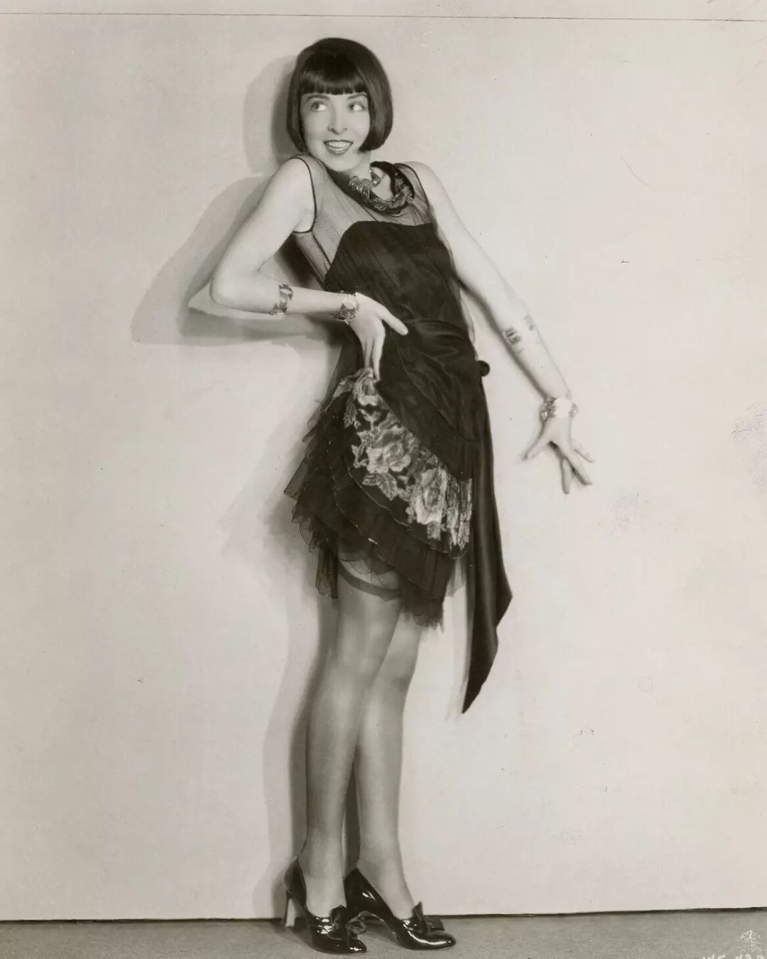 A portrait of Colleen Moore wearing flapper dress.