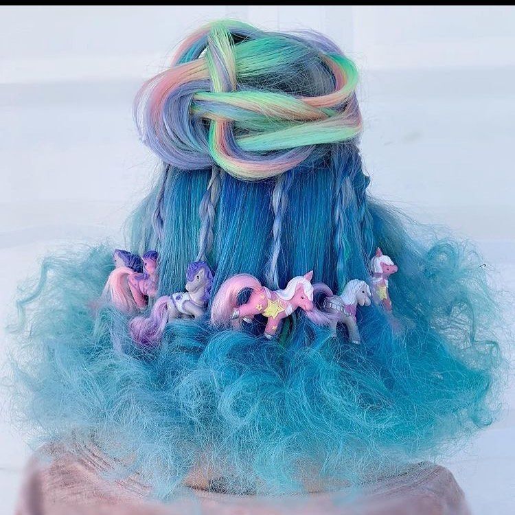Pastel rainbow hair with unicorns as accessories