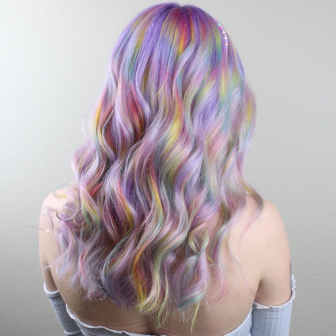 Back view of a girl with pastel colored rainbow hair