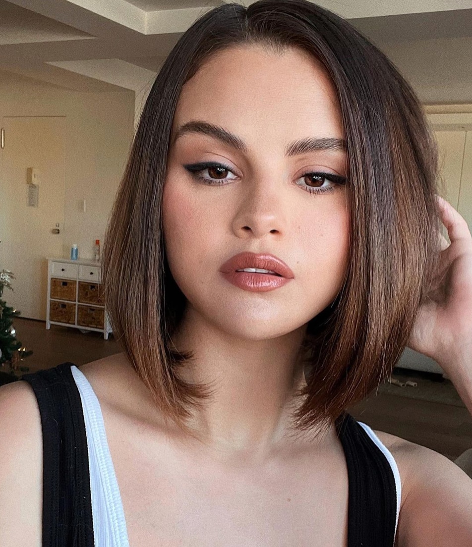 Selena Gomez brunette woman with asymmetrical hairstyle