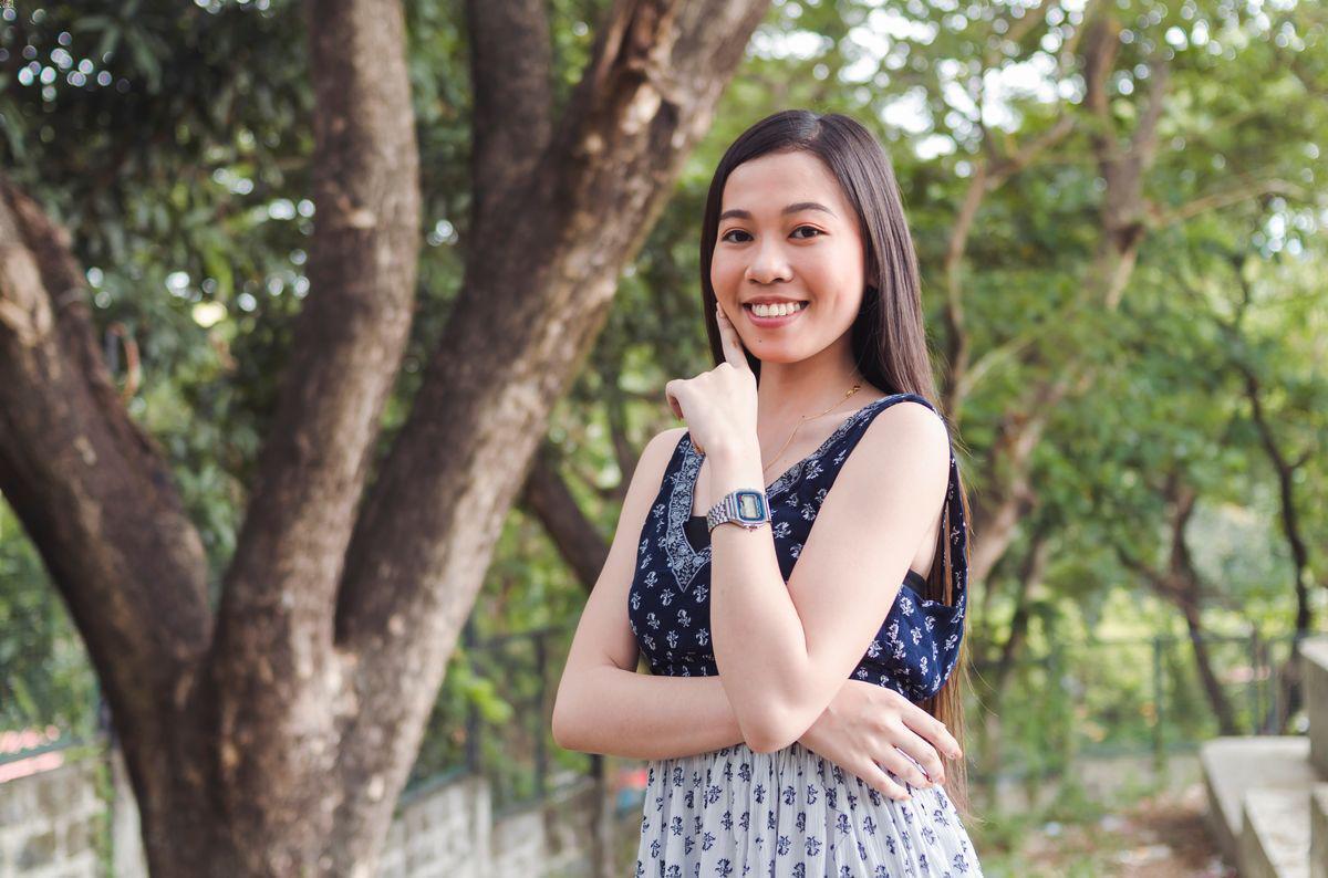 Filipino woman outdoors with trees 