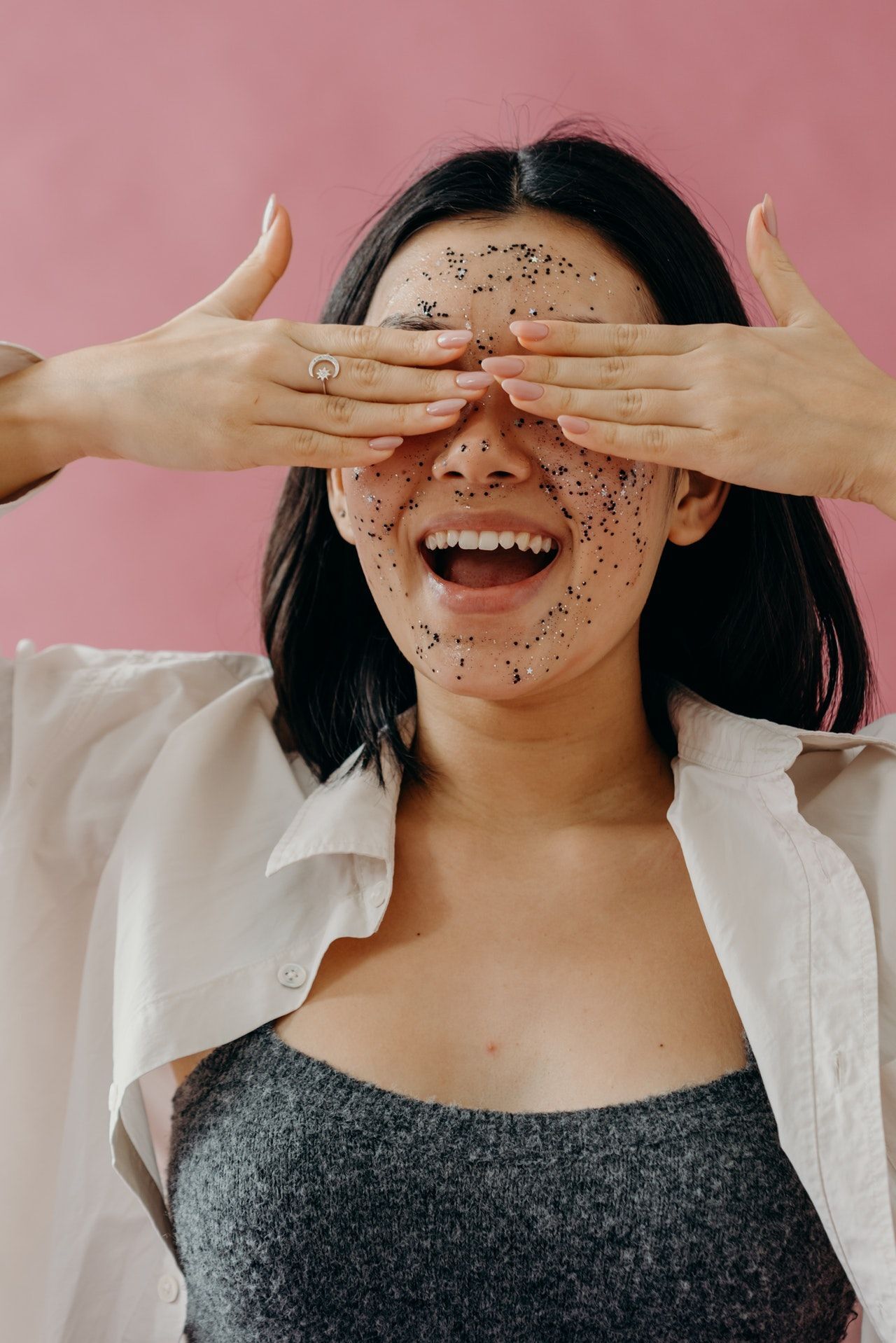 woman exfoliating her skin