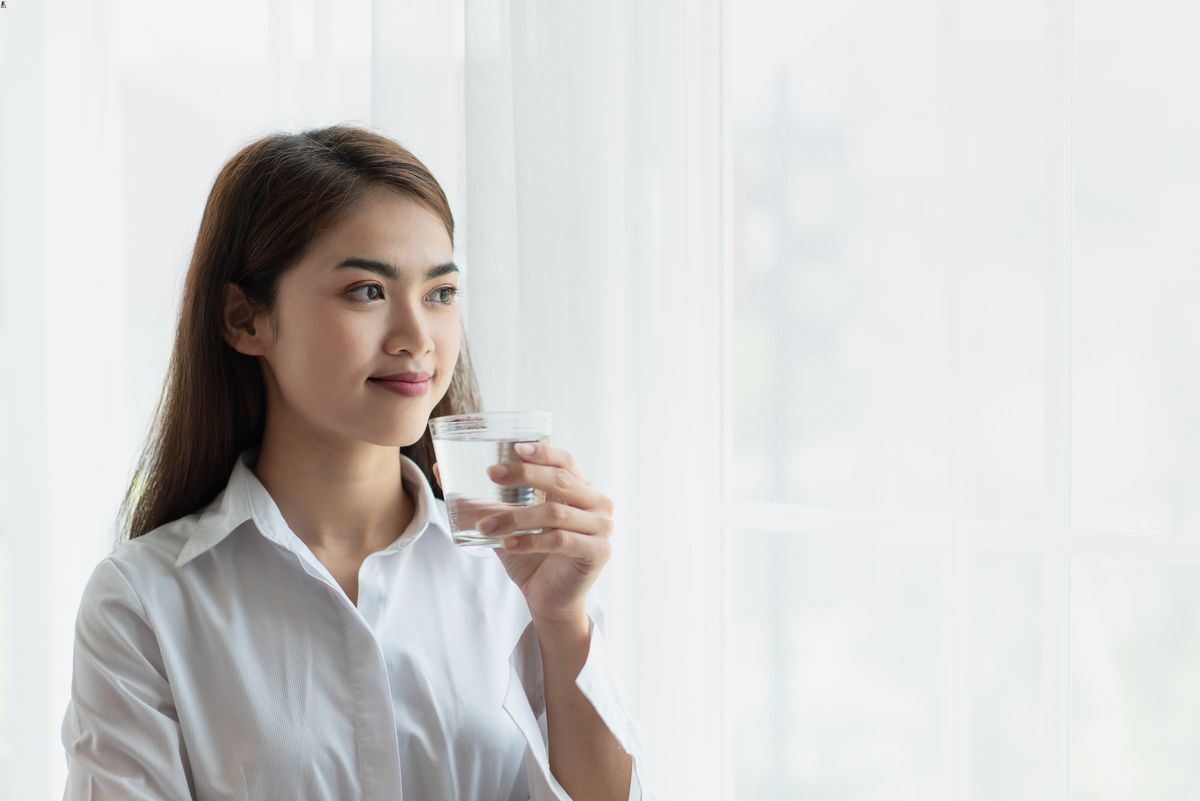 Asian woman drinking water