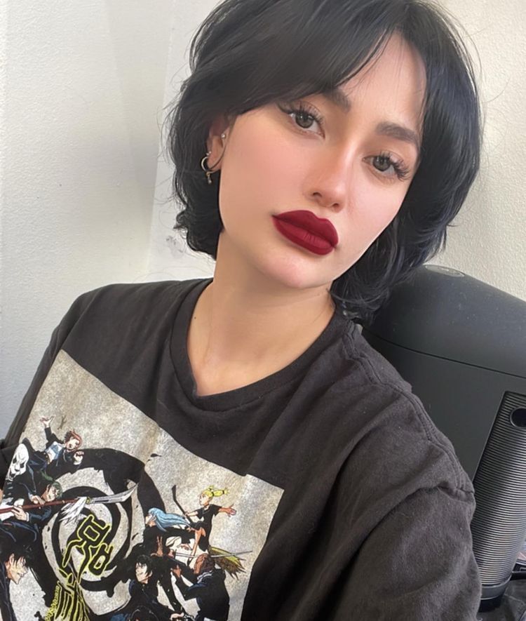Asian woman with short black hair and burgundy lips