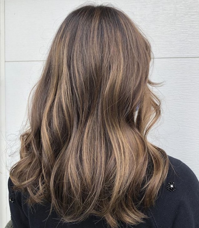 This color is great if you’re too scared to commit to fully blonde hair. 