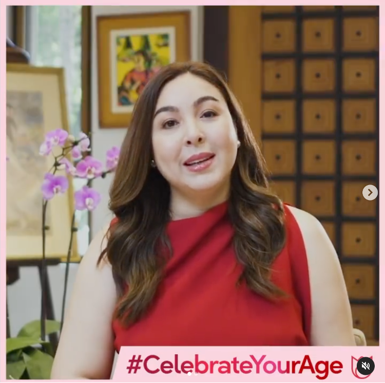 Marjorie Barretto in a red top in her living room