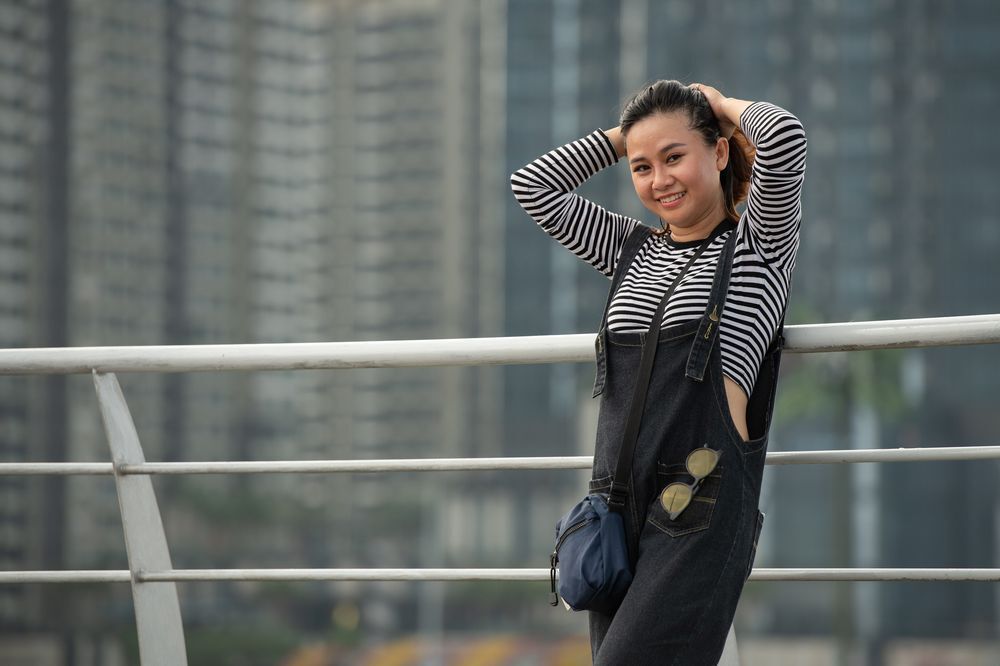 Asian woman wearing a striped crop top