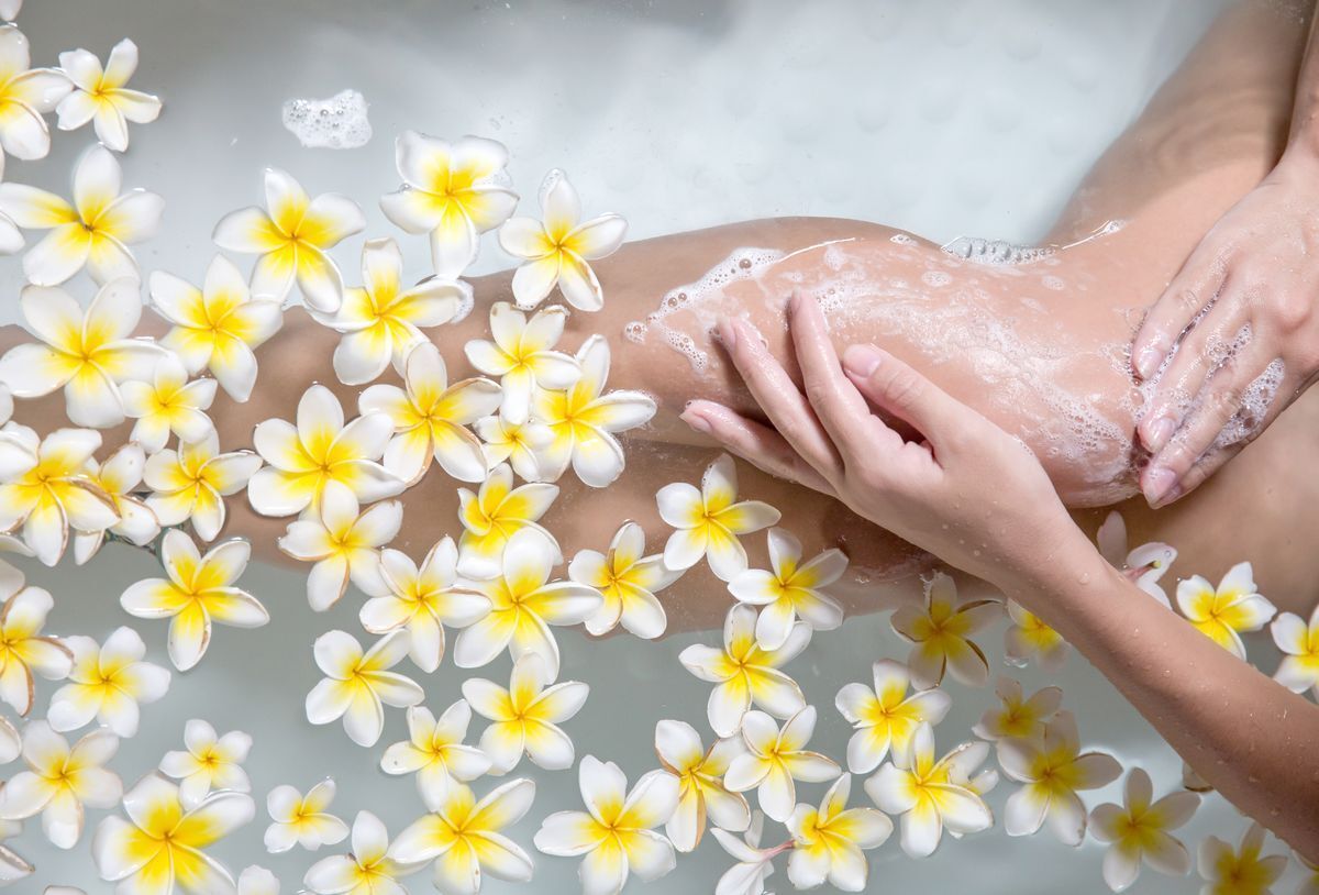 Girl in a kawa bath with flowers
