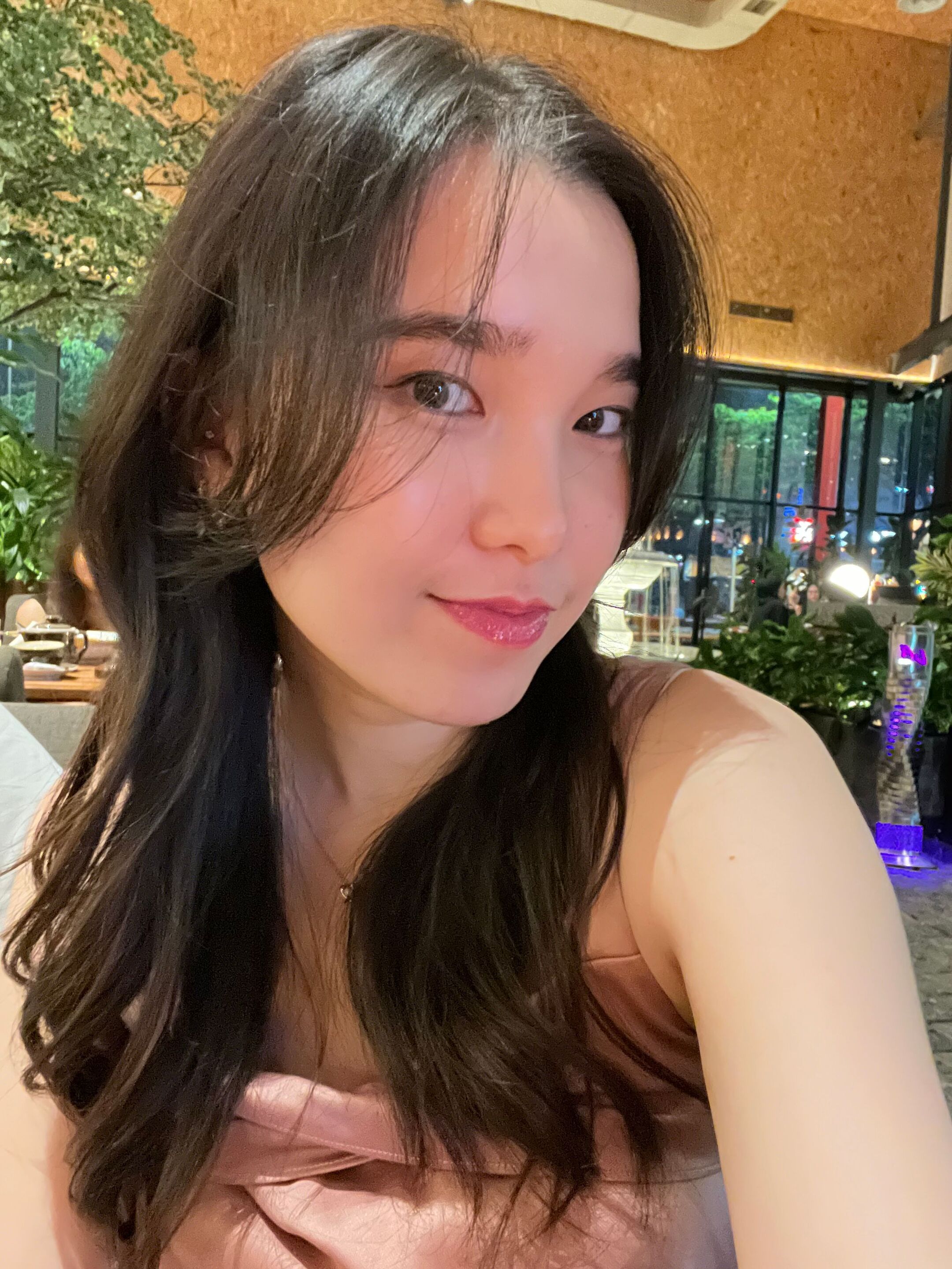 A selfie of woman with dark brown locks.