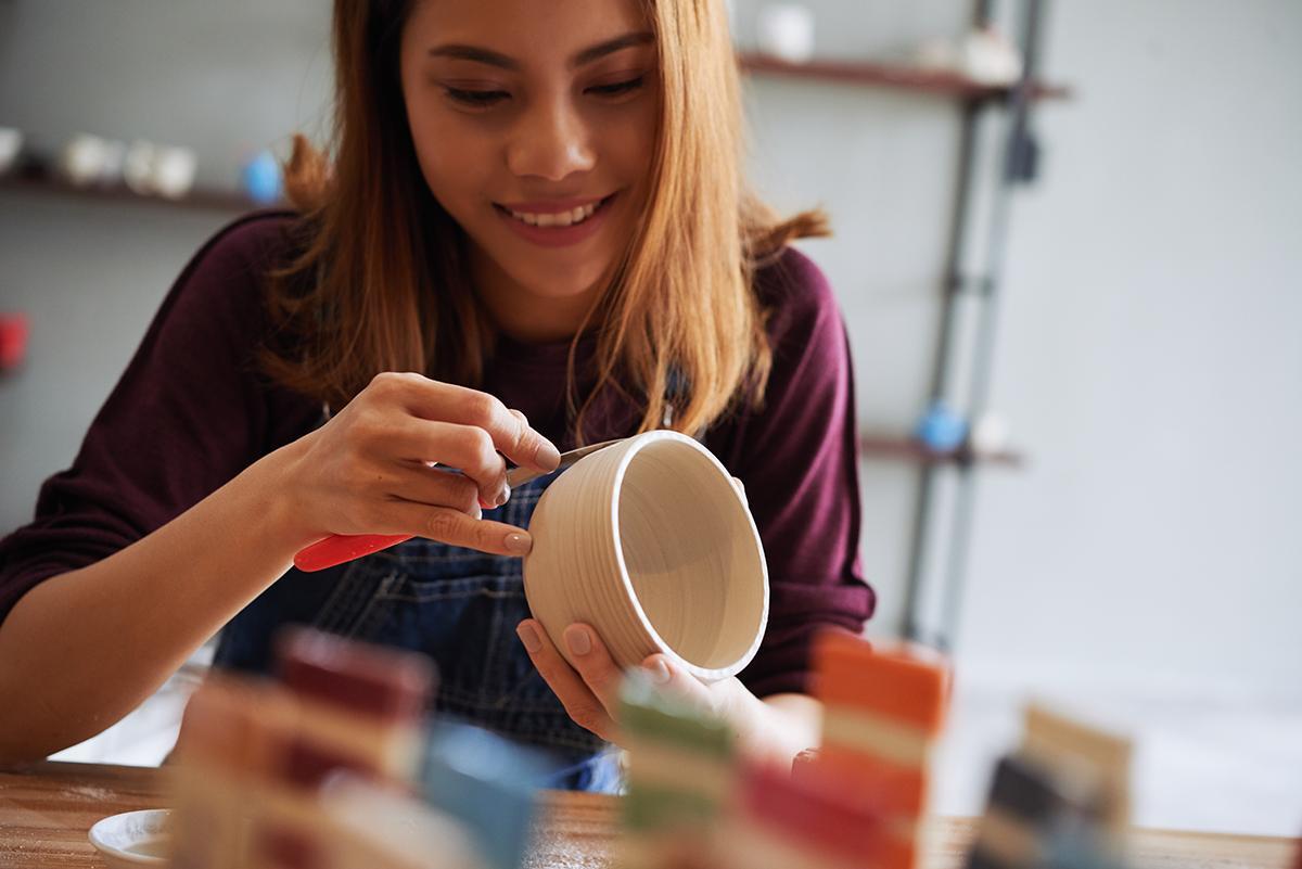 Asian woman doing pottery