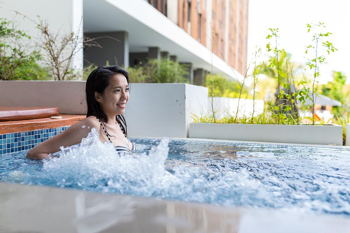 Asian woman in a jacuzzi
