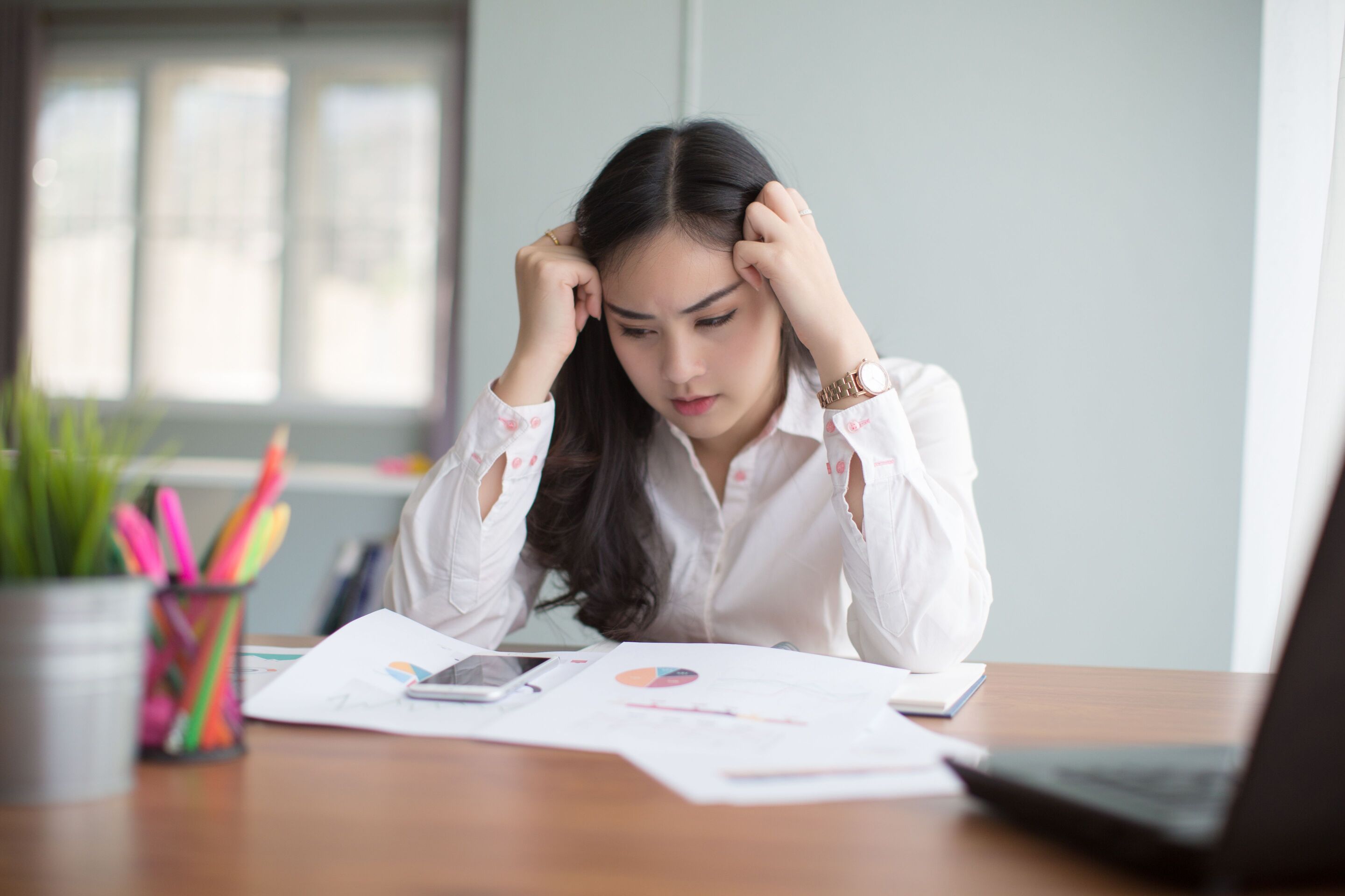 Professional businesswoman worrying touching hair
