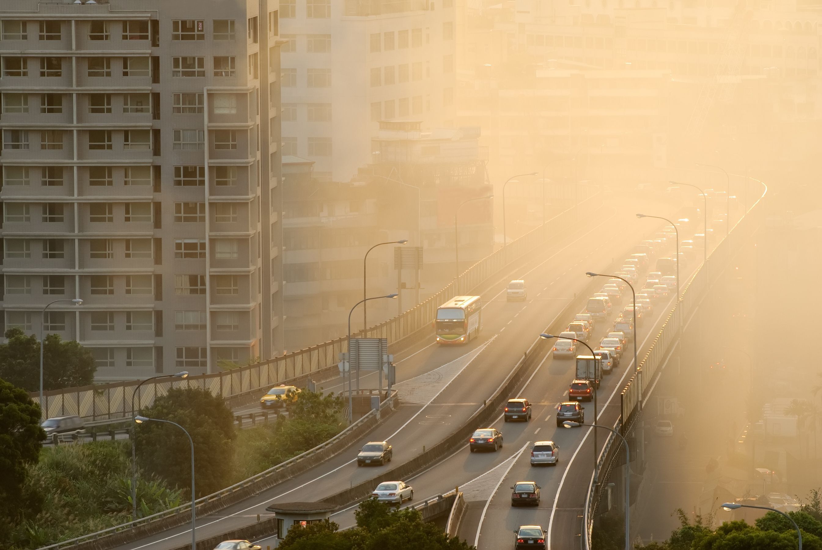 Air pollution coming from cars on a highway