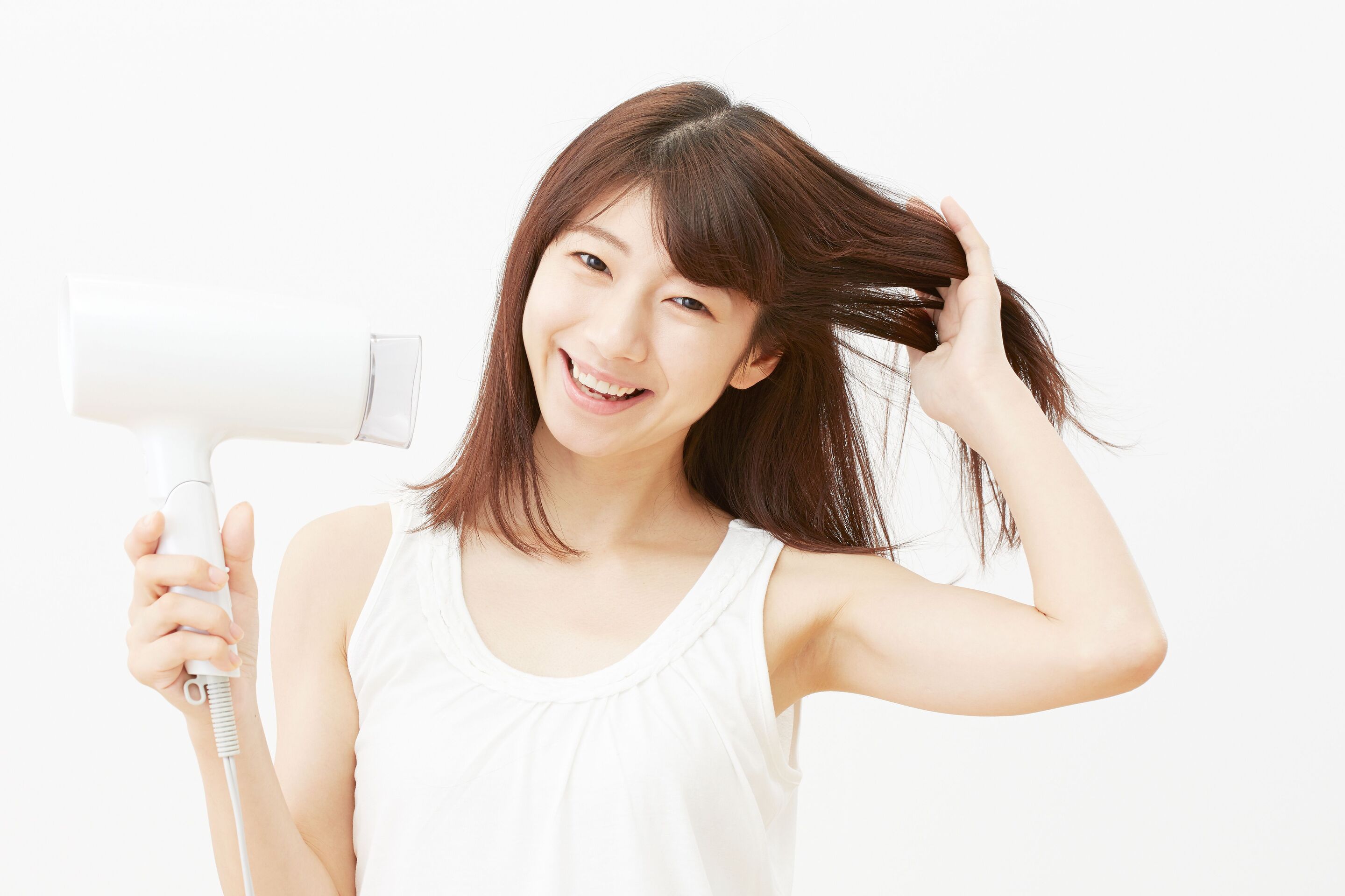 Asian woman dryer hair with a blowdryer