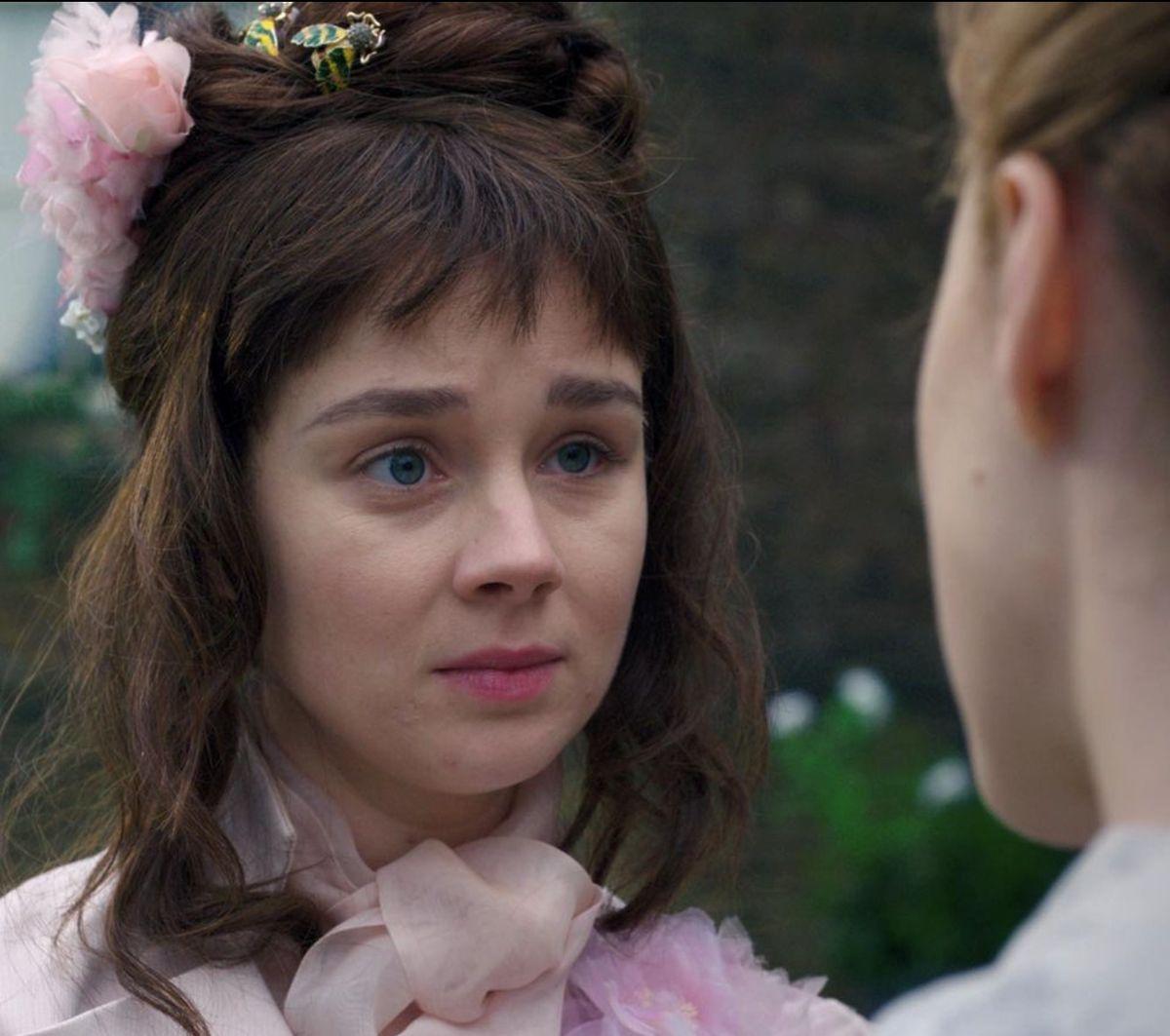 Confused young woman with baby bangs