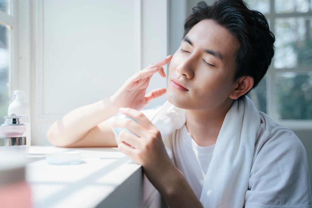 A man washing his face with water