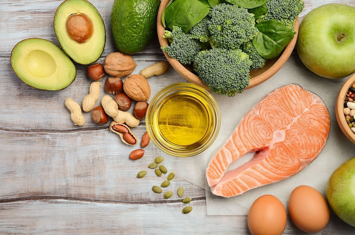 Flat lay of foods rich in omega 3 on a wooden board. 