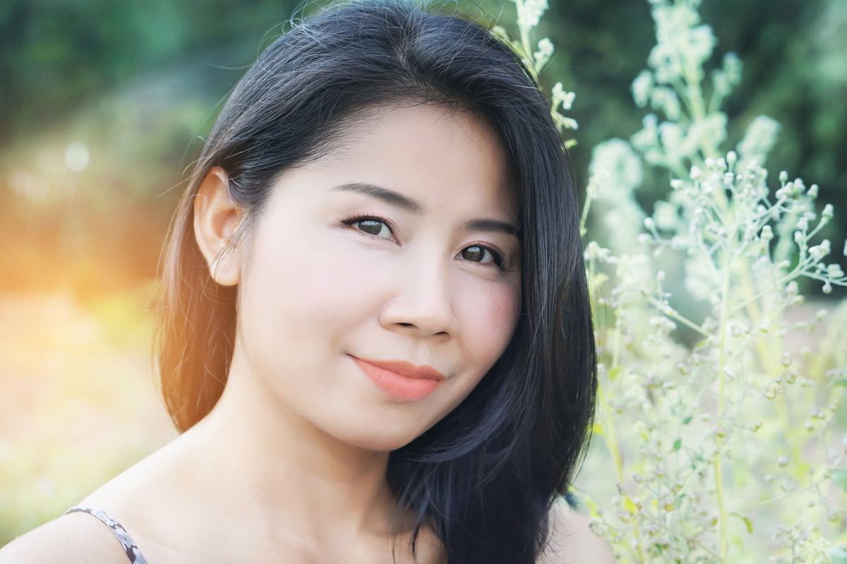 Asian woman with orange lipstick